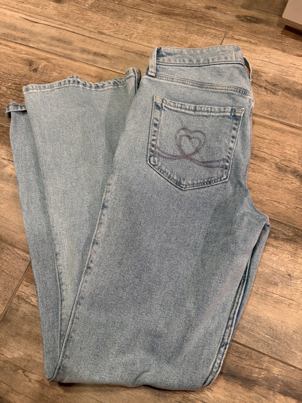 Hollister high rise fiare light wash women’s jeans with heart stitch.